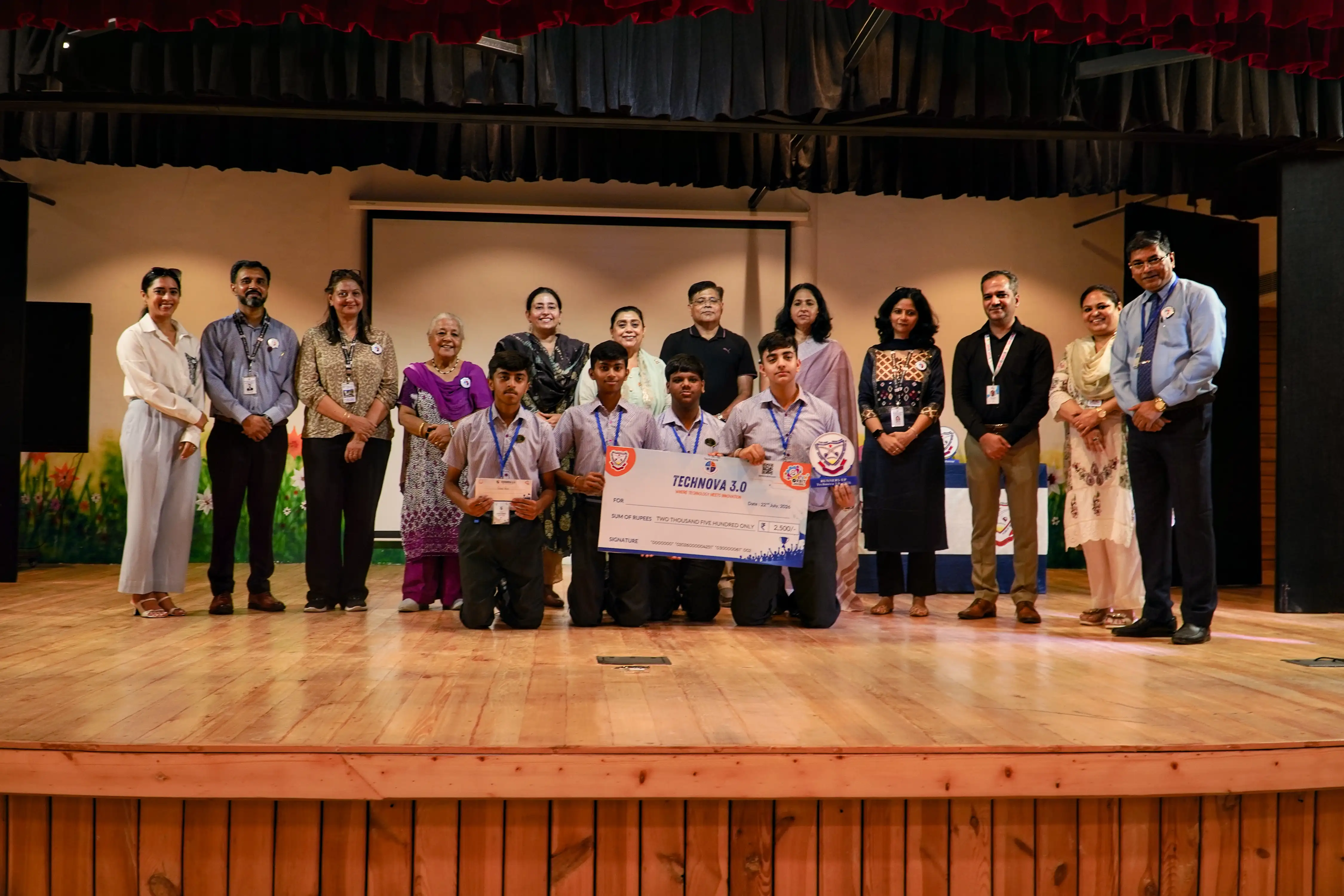 St. Soldier's School, Panchkula team receiving their ₹2,500 second prize cheque on stage