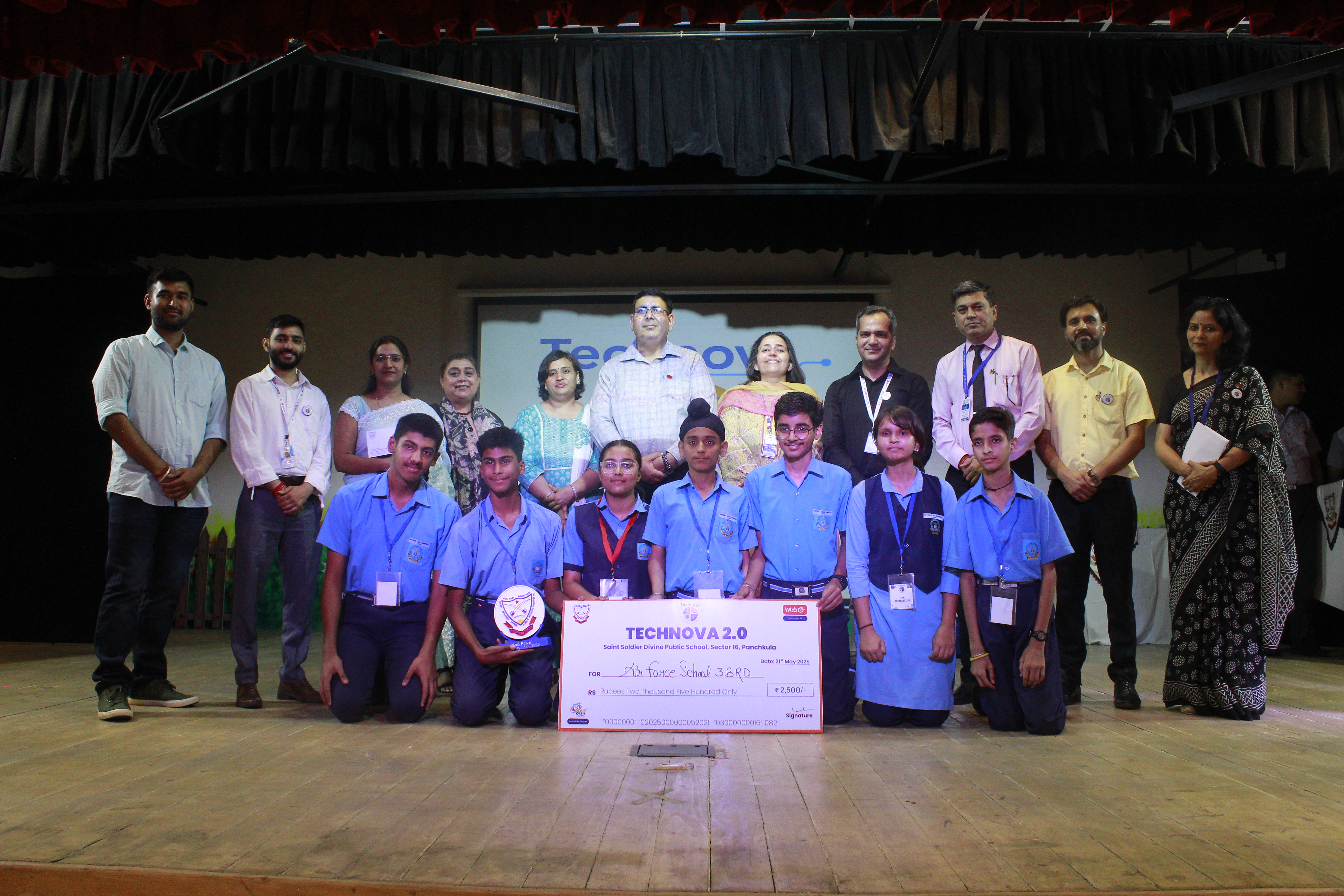 Winning team receiving recognition on stage